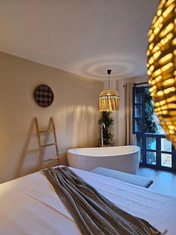 Postel nebo postele na pokoji v ubytování Poblado Luum Boutique hotel