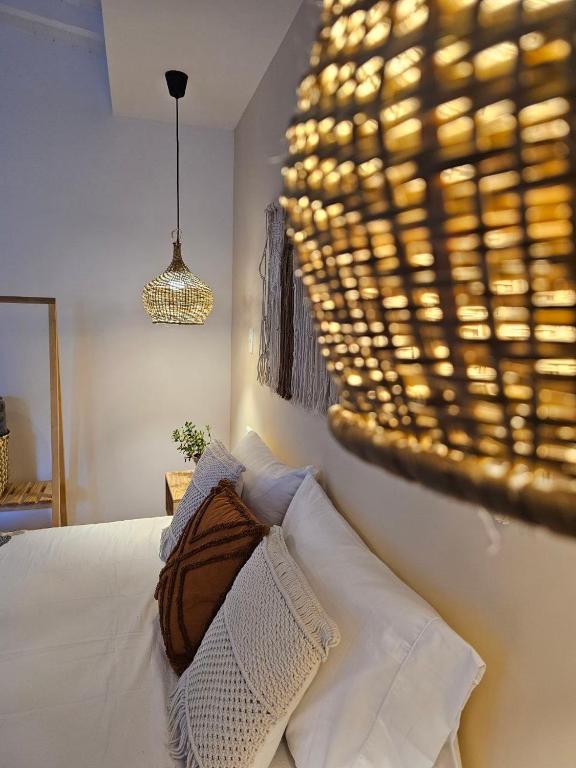 Postel nebo postele na pokoji v ubytování Poblado Luum Boutique hotel