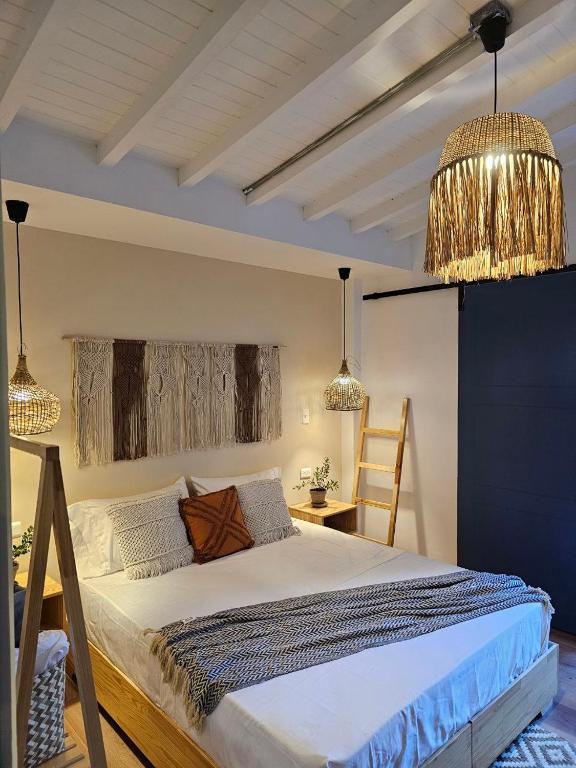 Postel nebo postele na pokoji v ubytování Poblado Luum Boutique hotel