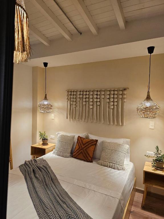 Postel nebo postele na pokoji v ubytování Poblado Luum Boutique hotel