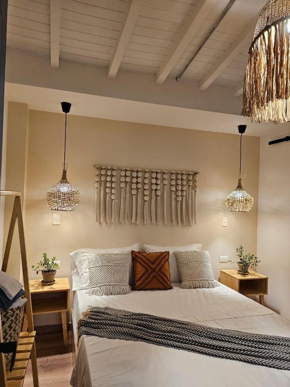 Postel nebo postele na pokoji v ubytování Poblado Luum Boutique hotel