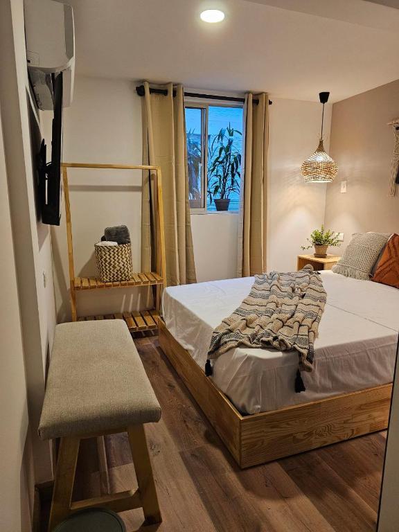 Postel nebo postele na pokoji v ubytování Poblado Luum Boutique hotel