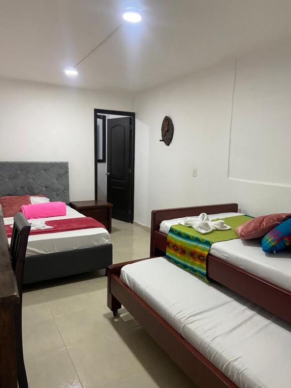 a room with two beds at Mi Balconcito in Salento