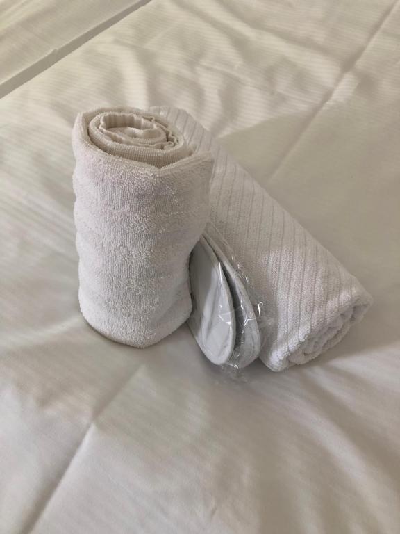 a sock sitting on top of a bed at MyCompass Hotel Offenbach in Offenbach