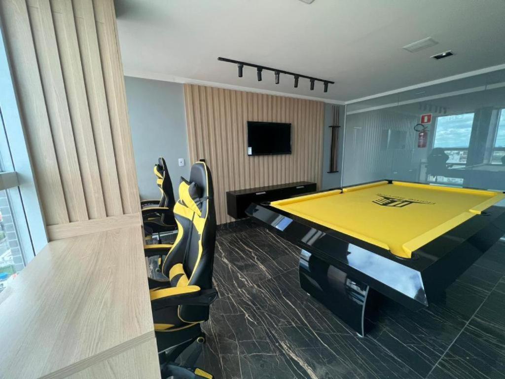 a conference room with a ping pong table in it at Apartamento Alto Padrão - Com Ar in Campina Grande
