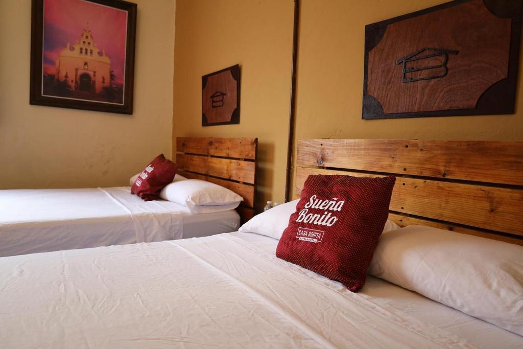 Postel nebo postele na pokoji v ubytování Casa Bonita Hotel y Hostal