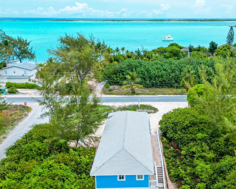 an aerial view of a house with the ocean in the background at Sheer Bliss BeachView Apt #1 in Georgetown