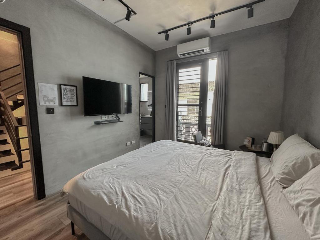 Letto o letti in una camera di hsueh_house