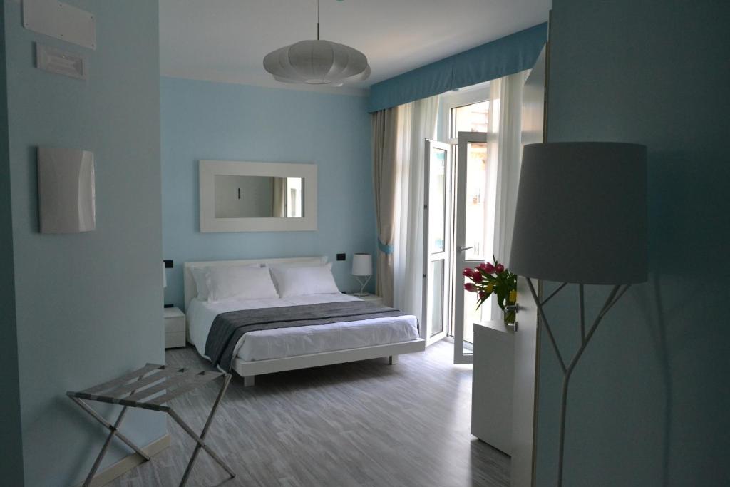 Łóżko lub łóżka w pokoju w obiekcie Hotel Villa Bernt