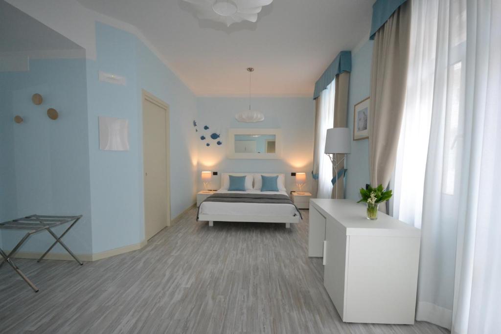 Łóżko lub łóżka w pokoju w obiekcie Hotel Villa Bernt