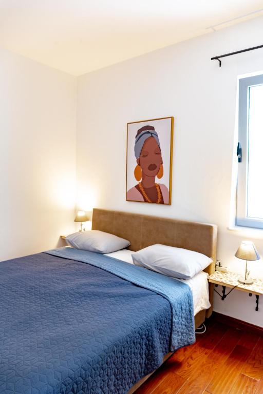 Postel nebo postele na pokoji v ubytování Apartments Castello Risano