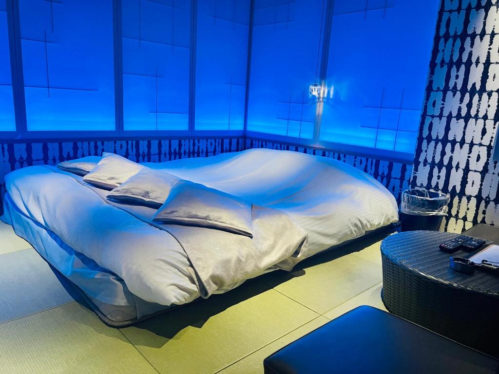 Postel nebo postele na pokoji v ubytování Asokono Hotel