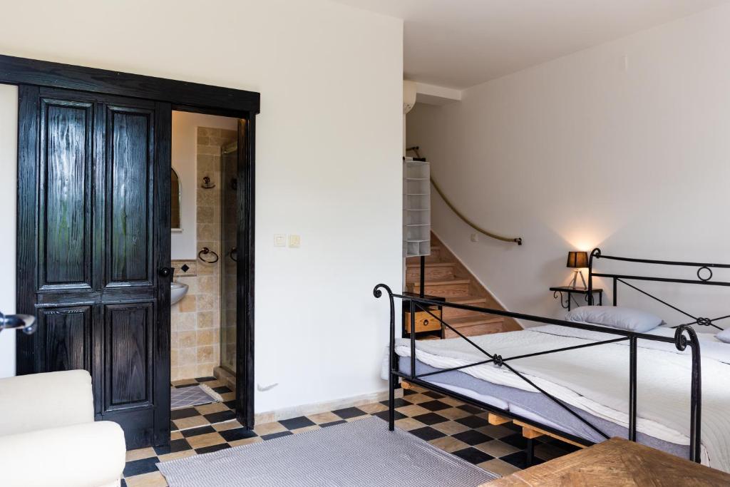 Postel nebo postele na pokoji v ubytování Apartments Castello Risano