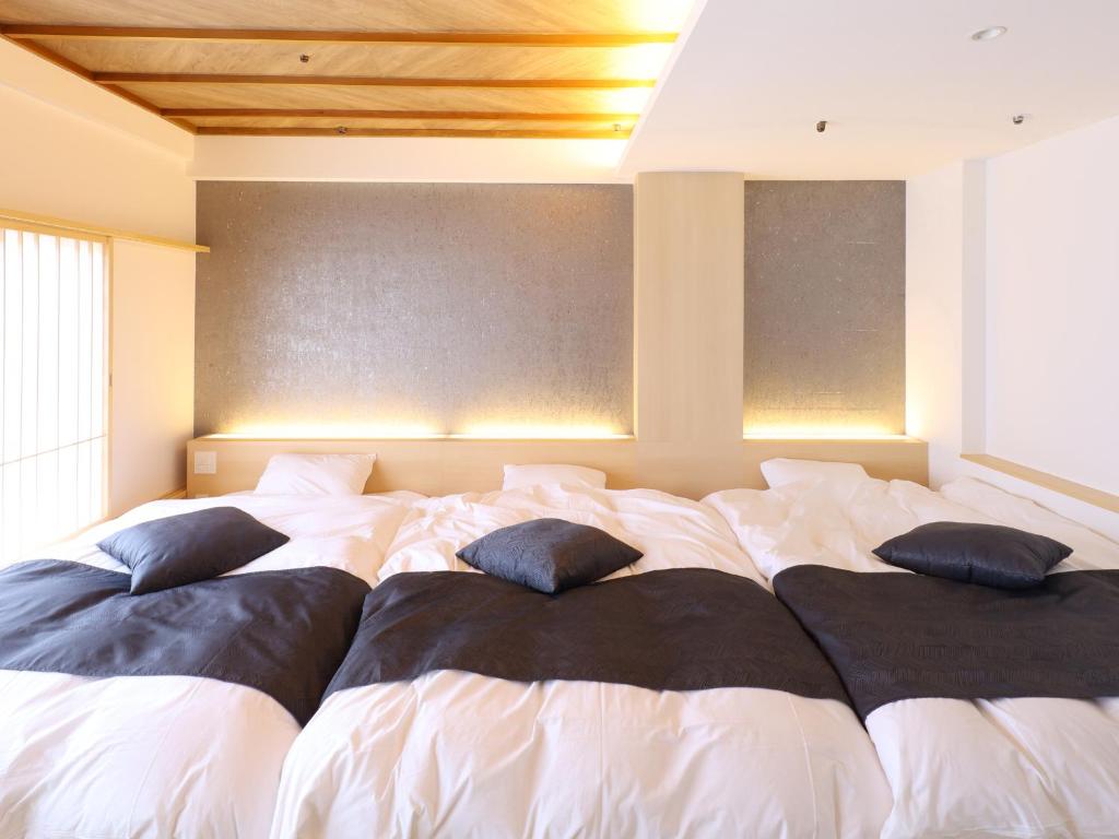 Postel nebo postele na pokoji v ubytování Hotel Fuji