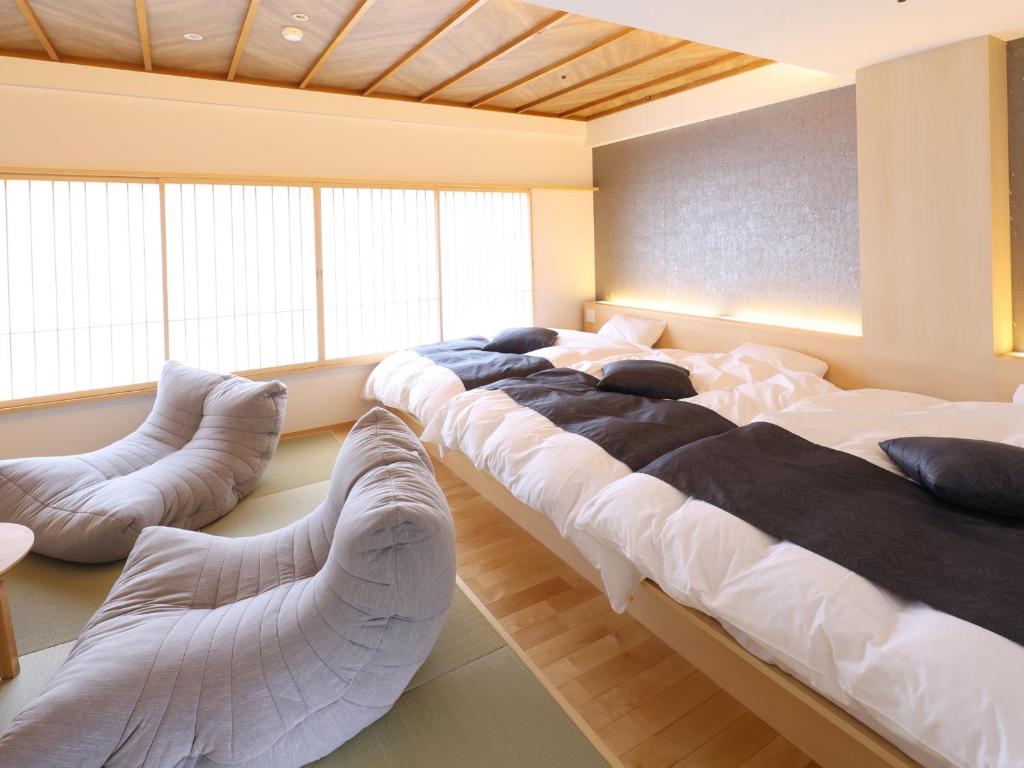 Postel nebo postele na pokoji v ubytování Hotel Fuji