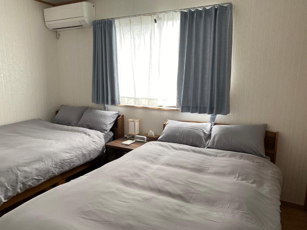 Postel nebo postele na pokoji v ubytování The Ritz Okinawa Kise 2 無料駐車2台3LDK2浴室