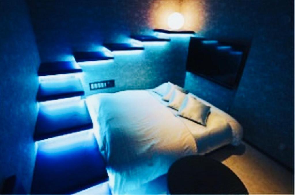 Postel nebo postele na pokoji v ubytování Asokono Hotel