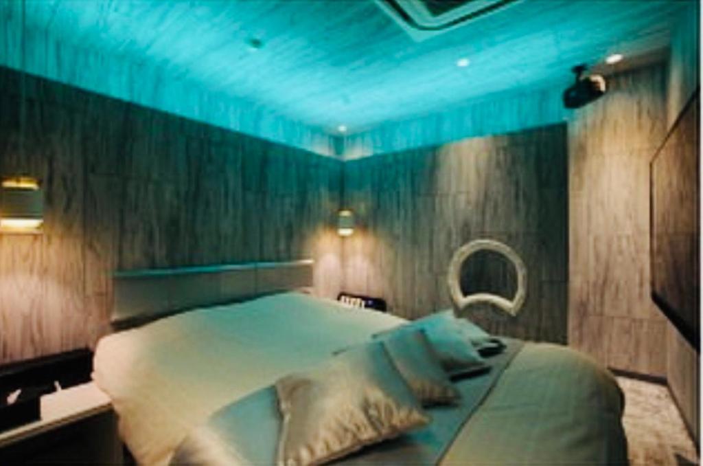 Postel nebo postele na pokoji v ubytování Asokono Hotel