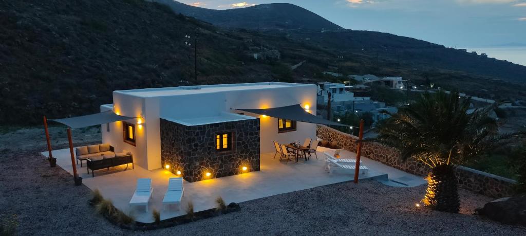 a small house with lights in front of it at Alios private villa in Imerovigli