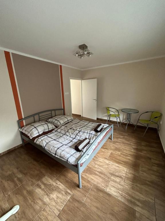 Ένα ή περισσότερα κρεβάτια σε δωμάτιο στο Babzsi Nyaraló