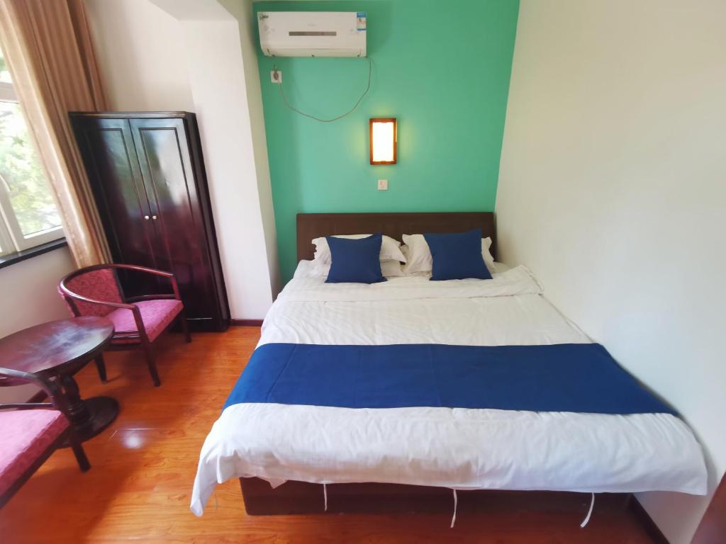 Postel nebo postele na pokoji v ubytování Beidaihe No. 3 Jinhai