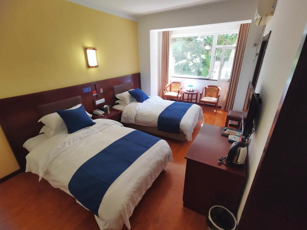 Postel nebo postele na pokoji v ubytování Beidaihe No. 3 Jinhai