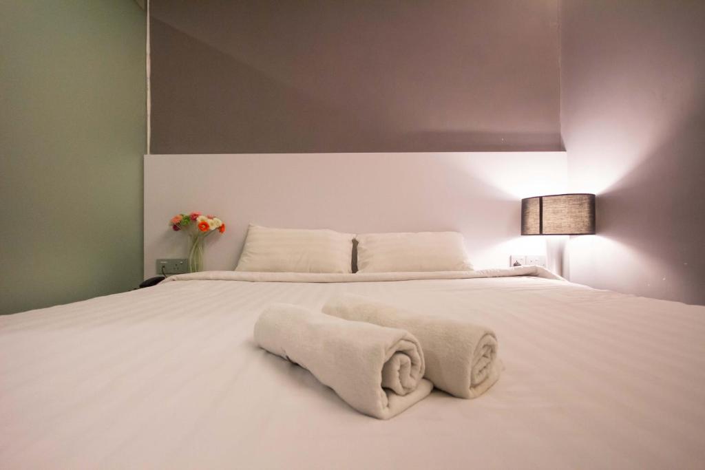 Postel nebo postele na pokoji v ubytování Chariton Hotel Ipoh