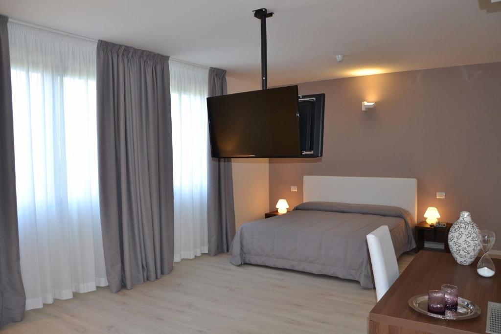 Postel nebo postele na pokoji v ubytování Park Hotel Sant'Elia