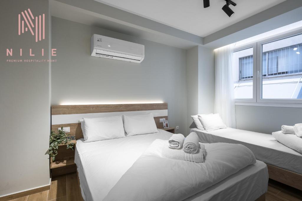 Posteľ alebo postele v izbe v ubytovaní Ultima, Nilie Hospitality MGMT