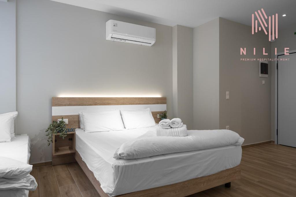 Posteľ alebo postele v izbe v ubytovaní Ultima, Nilie Hospitality MGMT