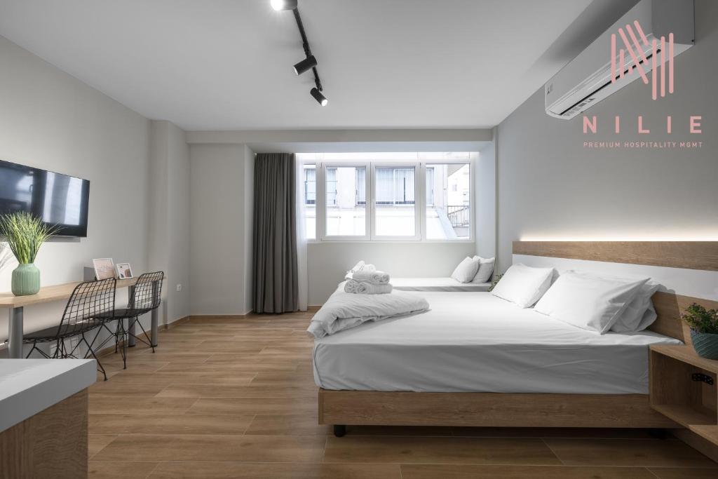 Posteľ alebo postele v izbe v ubytovaní Ultima, Nilie Hospitality MGMT