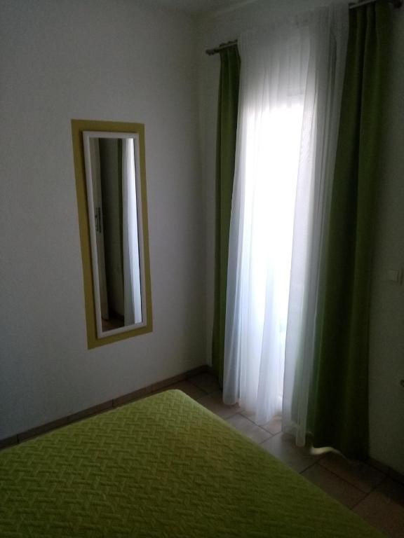 Postel nebo postele na pokoji v ubytování Apartmani Cesar