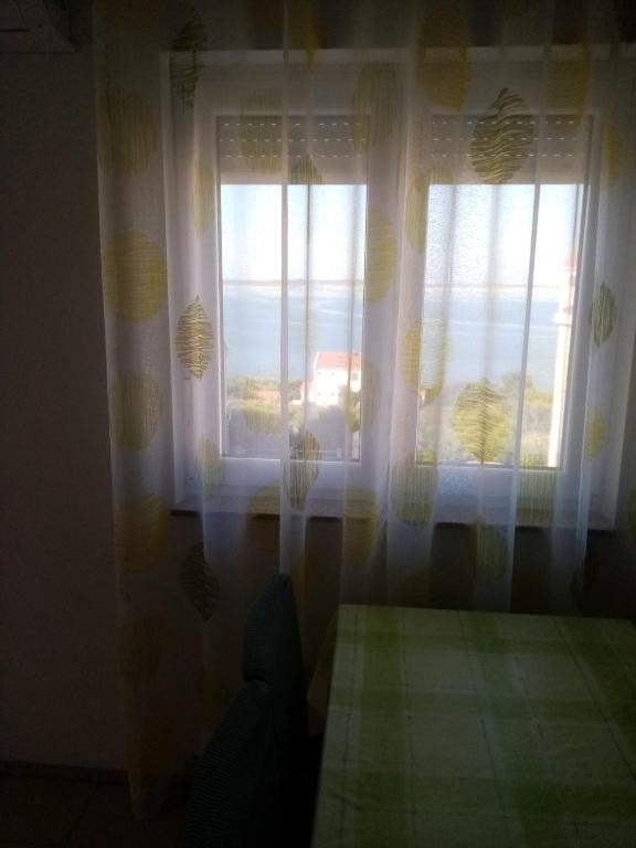 Postel nebo postele na pokoji v ubytování Apartmani Cesar