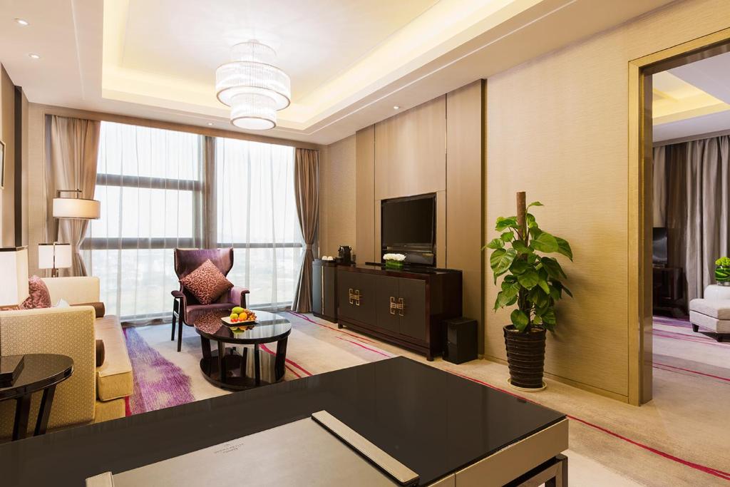 TV a/nebo společenská místnost v ubytování Maanshan Wanda Realm Hotel