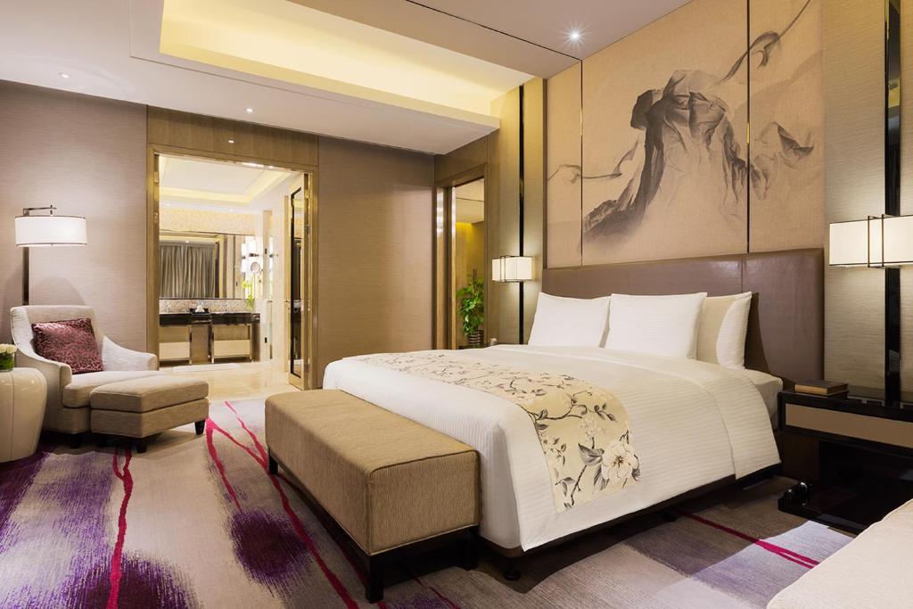 Postel nebo postele na pokoji v ubytování Maanshan Wanda Realm Hotel