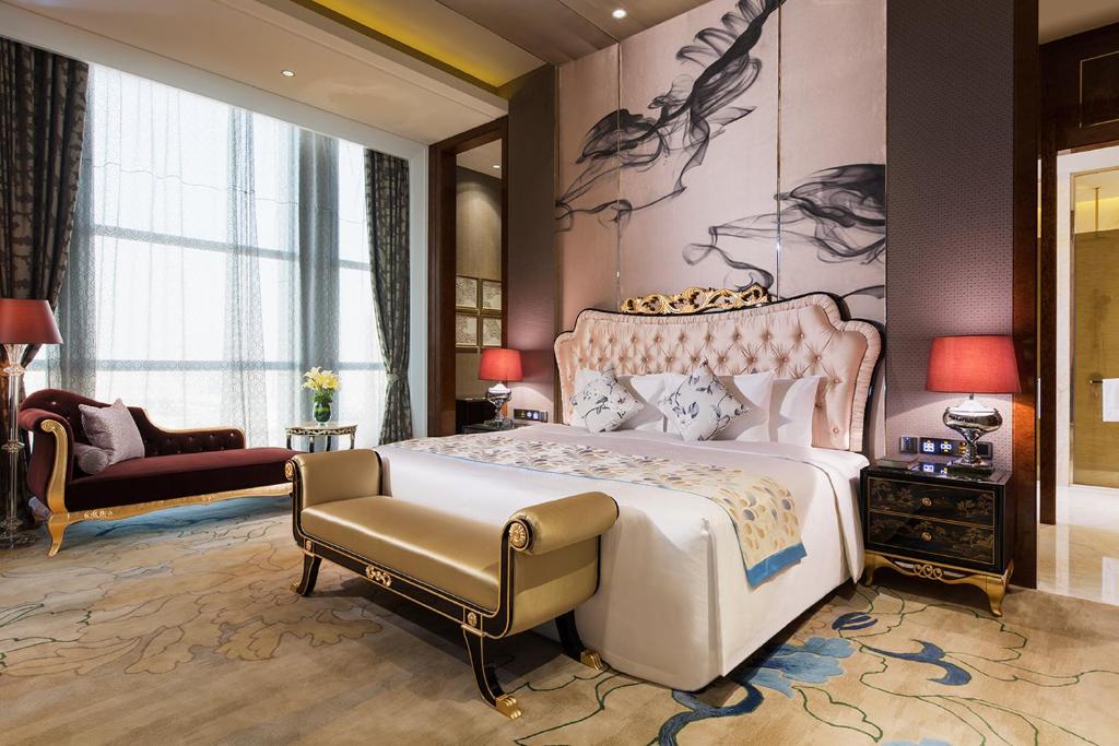 Ліжко або ліжка в номері Maanshan Wanda Realm Hotel