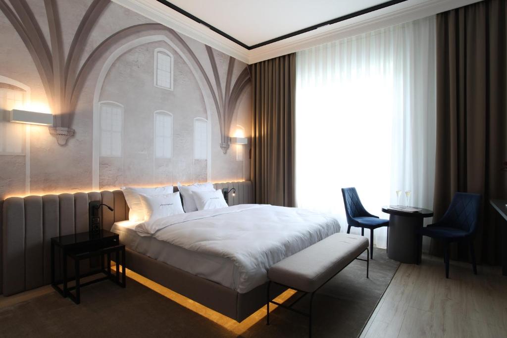 Postel nebo postele na pokoji v ubytování Villa Boutique Hotel