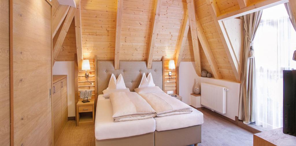 Postel nebo postele na pokoji v ubytování Salnerhof Superior Lifestyle Resort