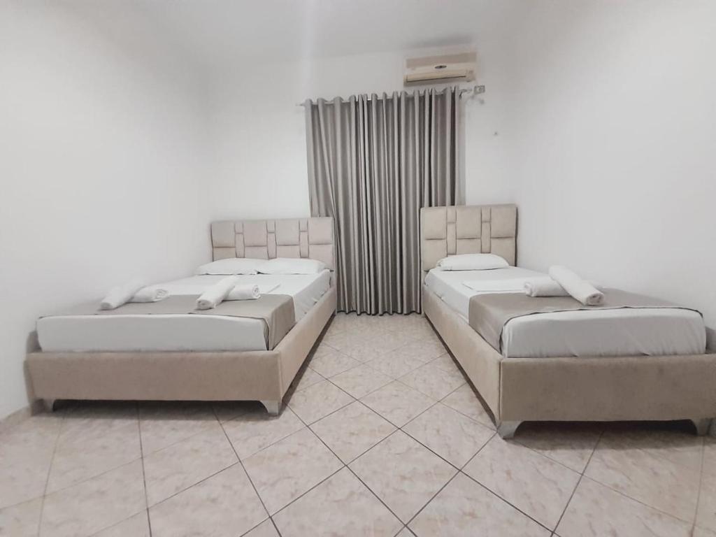 Postel nebo postele na pokoji v ubytování Hotel Vila Vilson
