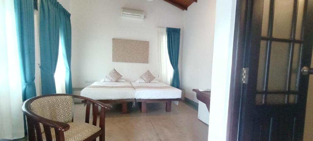 Postel nebo postele na pokoji v ubytování Kaya Residence Kandy
