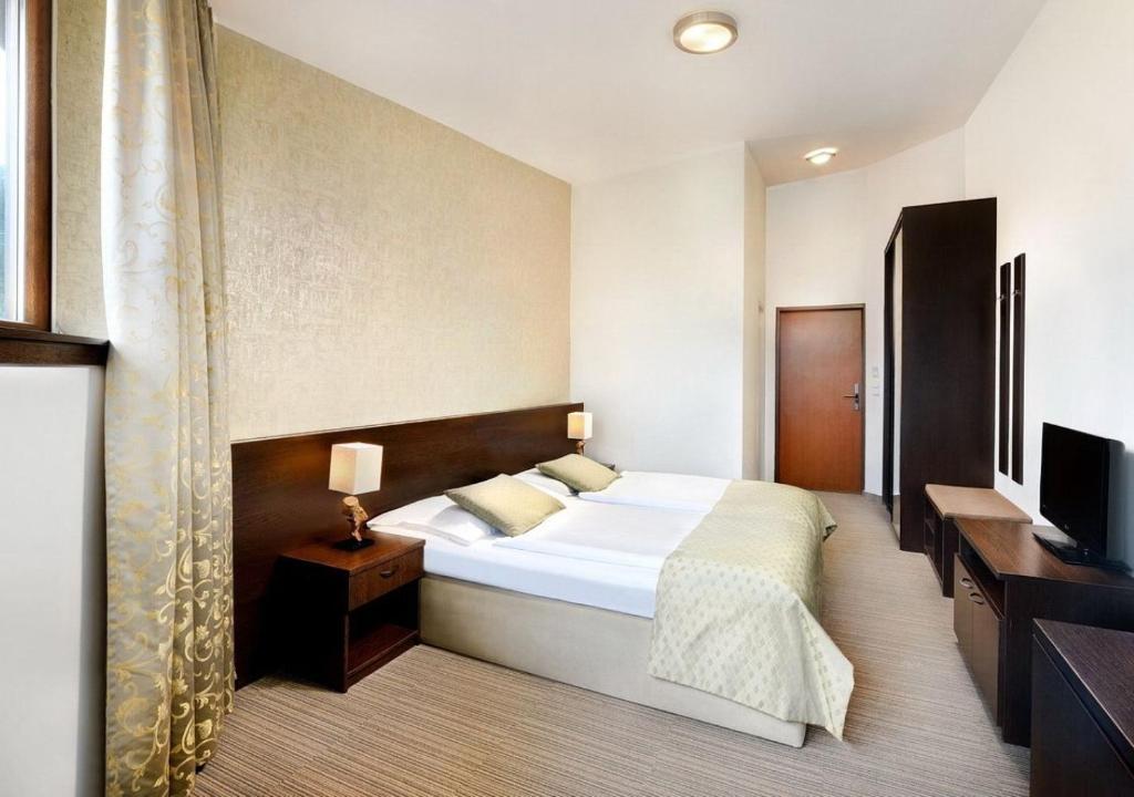Postel nebo postele na pokoji v ubytování Hotel Grand Jasná