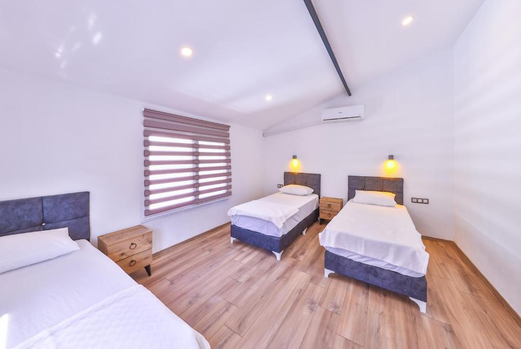 A bed or beds in a room at 3 House Apart