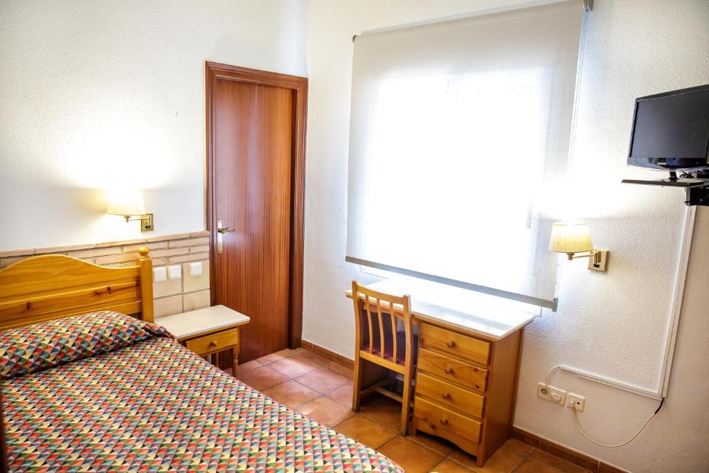 Postel nebo postele na pokoji v ubytování Hotel Can Solé