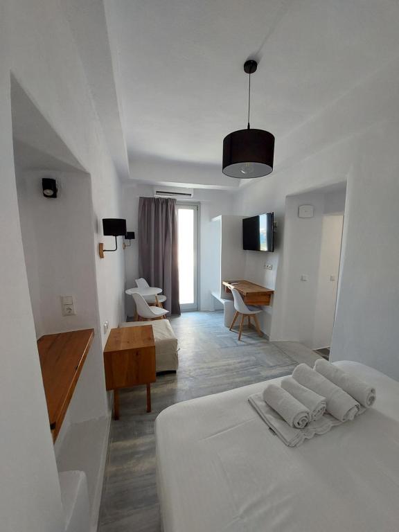 Postel nebo postele na pokoji v ubytování Castellino Naxos