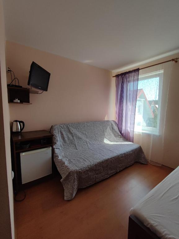 Posteľ alebo postele v izbe v ubytovaní Noce i dnie