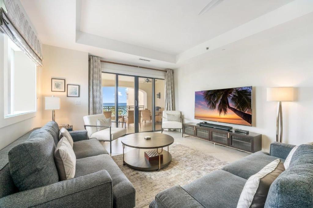 a living room with a couch and a table at Ocean View Residence 501 located at The Ritz-Carlton in Upper Land