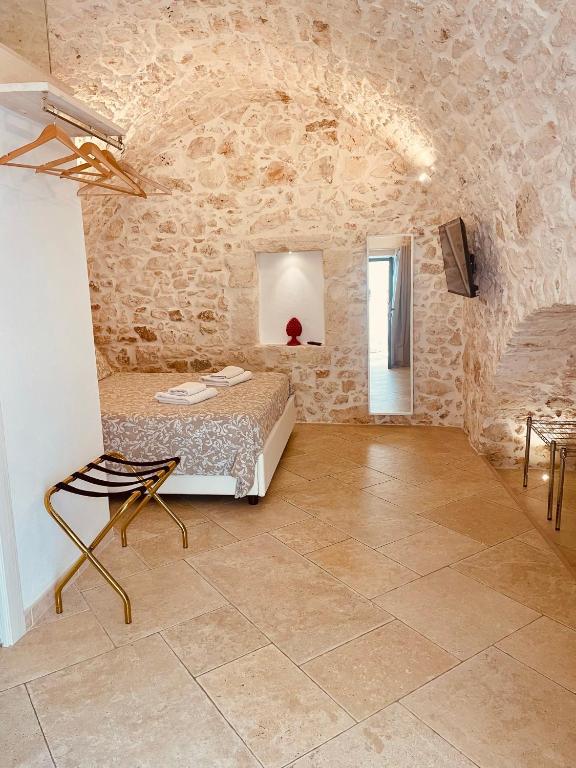 Łóżko lub łóżka w pokoju w obiekcie white room Ostuni