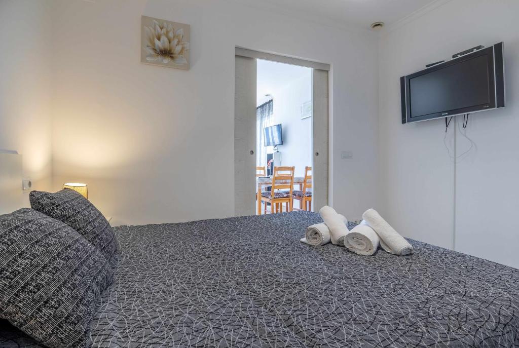 Posteľ alebo postele v izbe v ubytovaní Inftour President 1 Apartamento