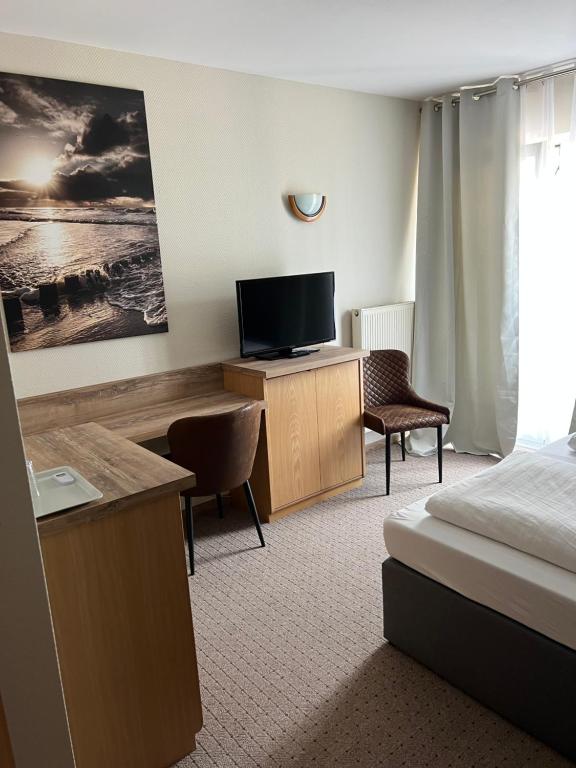 TV a/nebo společenská místnost v ubytování Hotel Aggertal