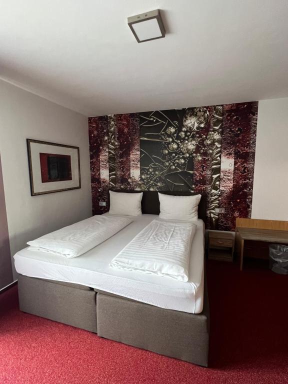 Postel nebo postele na pokoji v ubytování Hotel Aggertal